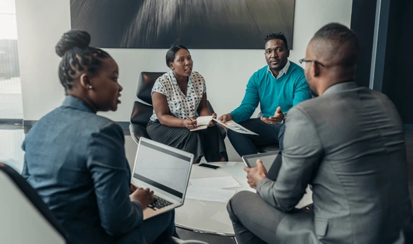 What is a CRM? - Who can use a CRM? Image of Colleagues in office space - Offixpro CRM